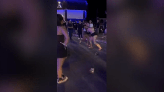 The two women reportedly threw punches over a man's attention