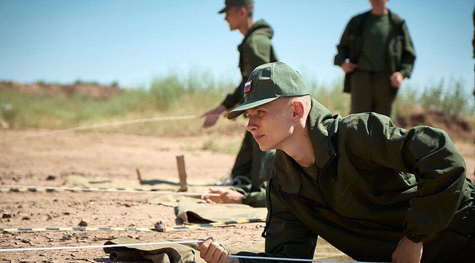 Another kid being trained on how to clear a minefield