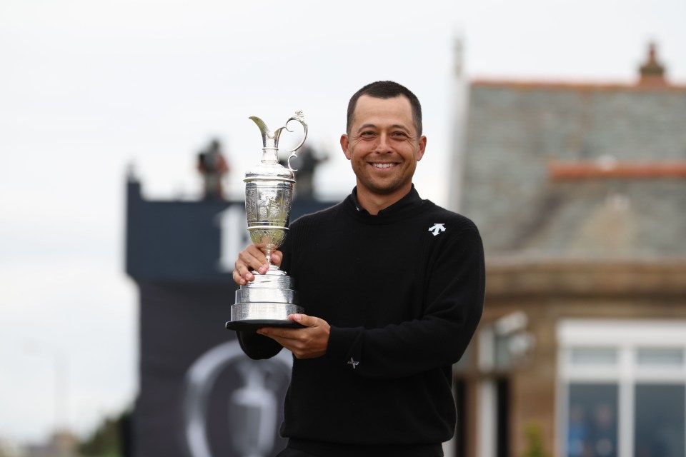 Xander Schauffele celebrates with the Claret Jug trophy after winning the British Open Championship