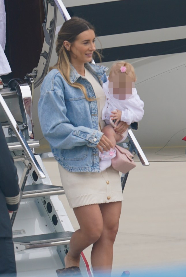 Dani Dyer arrived carrying one of her twin daughters