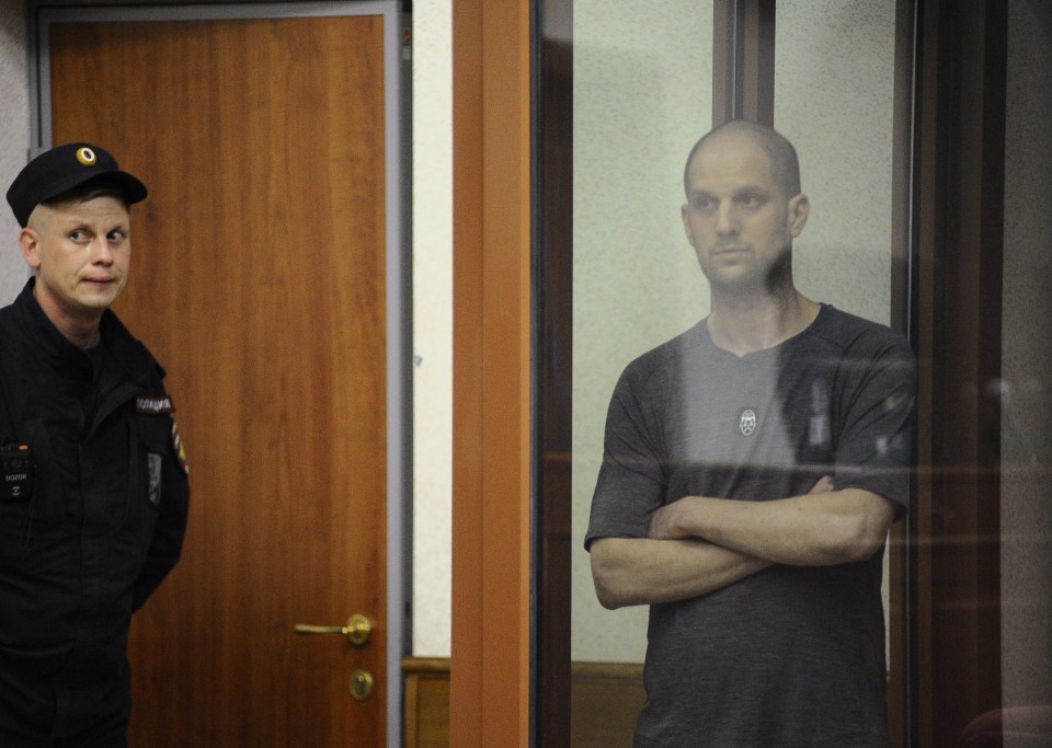 Wall Street Journal reporter Evan Gershkovich hears the verdict today in Russian court as he defiantly smiles