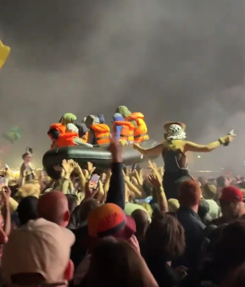 Banksy floated an inflatable migrant boat over the crowd at Glastonbury as a political statement