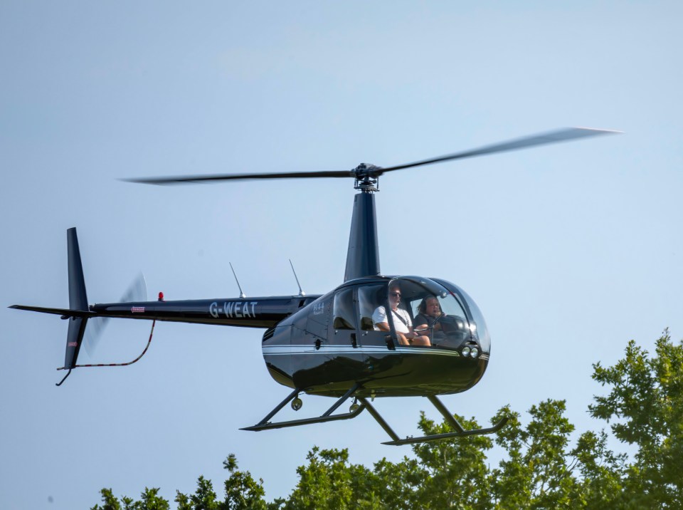 a black helicopter with the letters g-wear on the tail