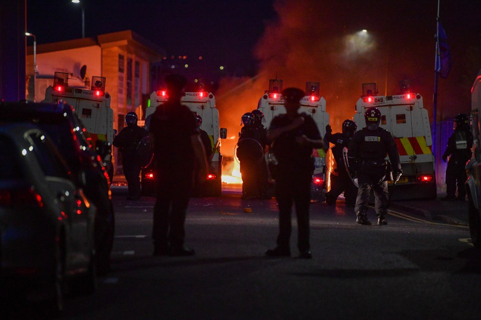 Several cars, a building and bins were set on fire in Belfast as chaos escalated