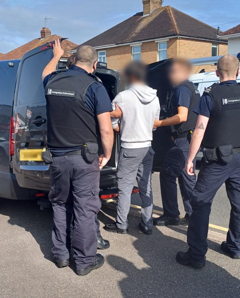 a group of police officers are standing in front of a van that says ' metropolitan police service ' on it