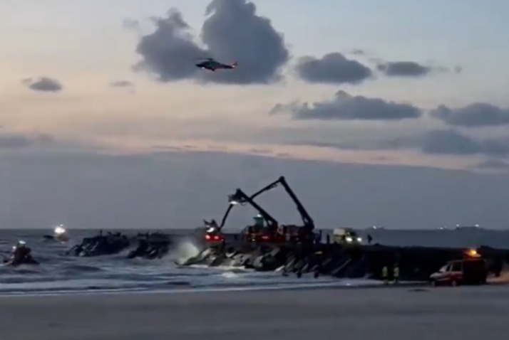 a helicopter is flying over a large body of water