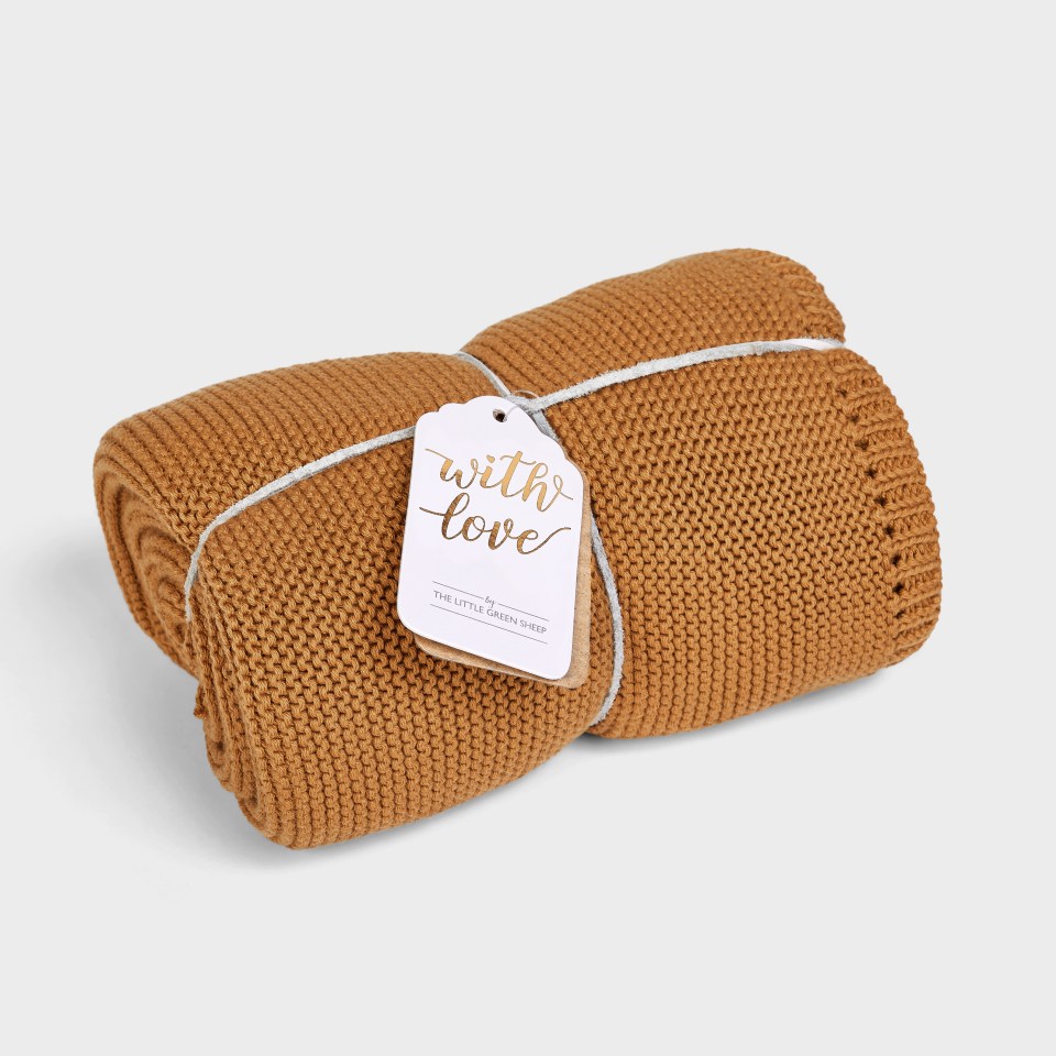 a brown blanket with a tag that says with love