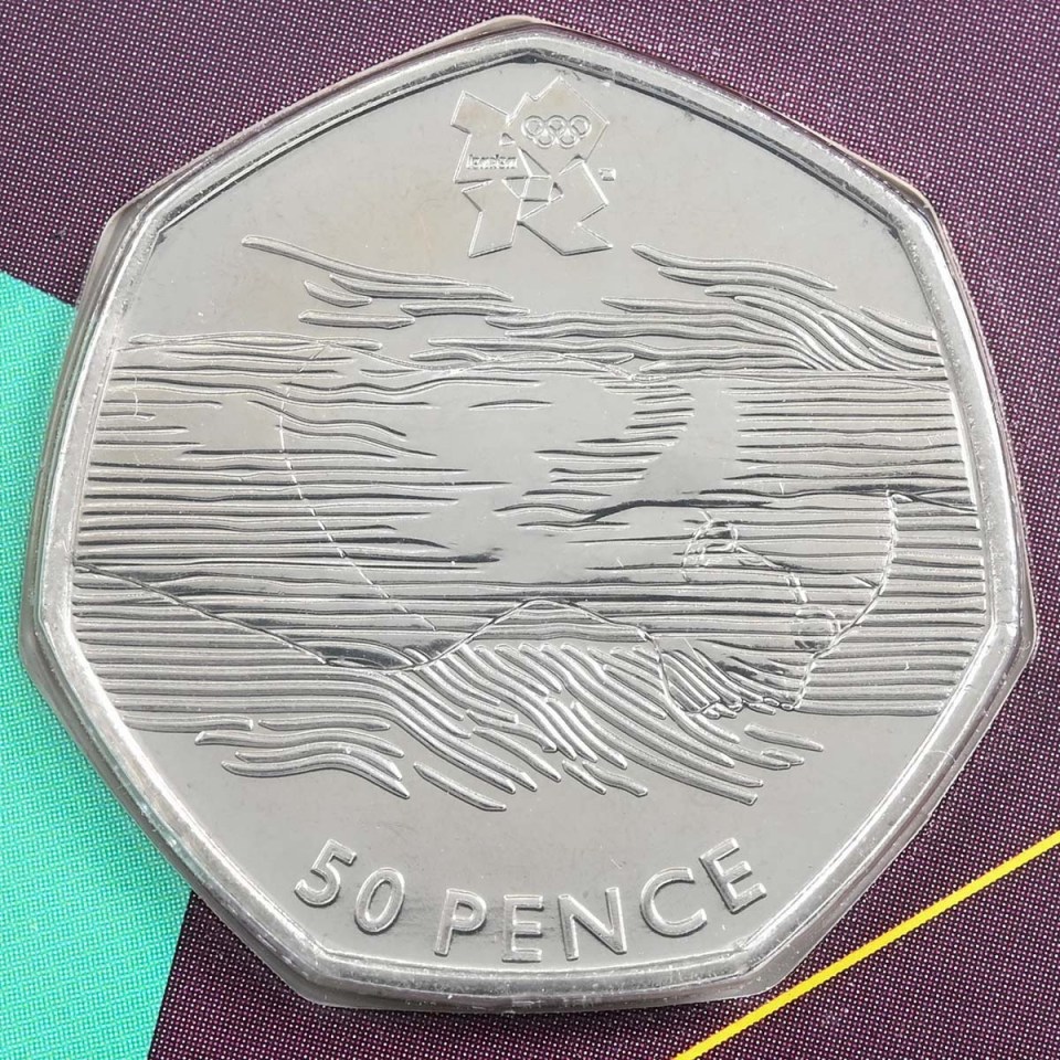 a 50 pence coin is sitting on a table