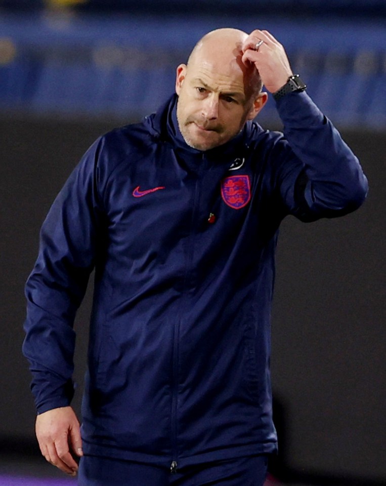 a man wearing a nike jacket with england on it