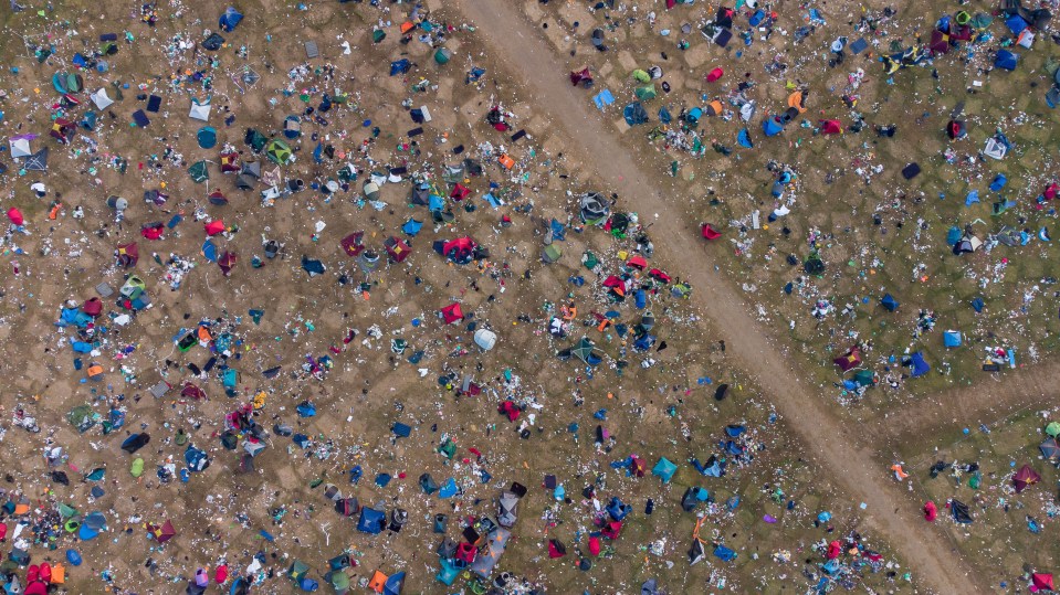 Drone footage shows abandoned tents and piles of rubbish after a day of chaos at Reading Festival