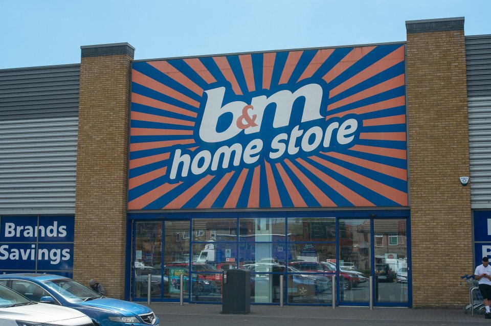 a b & m home store with cars parked outside