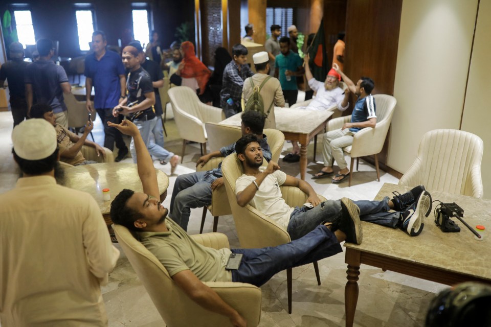 Anti-government protestors relax inside the prime minister's home