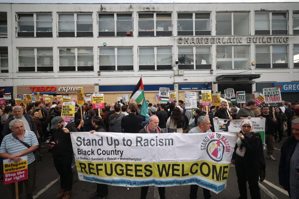 Stand Up to Racism protesters outside an immigration help centre in Birmingham