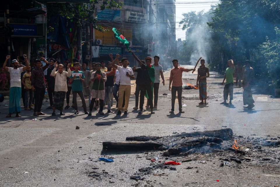 Protesters are blocking a road during a protest in Dhaka