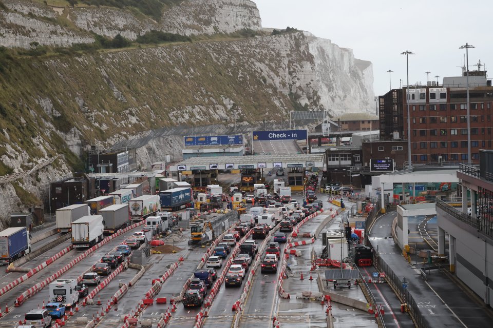 a busy highway with a blue sign that says check-in