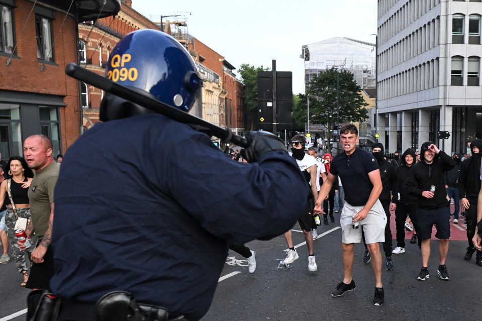 a police officer with the number 2090 on his helmet