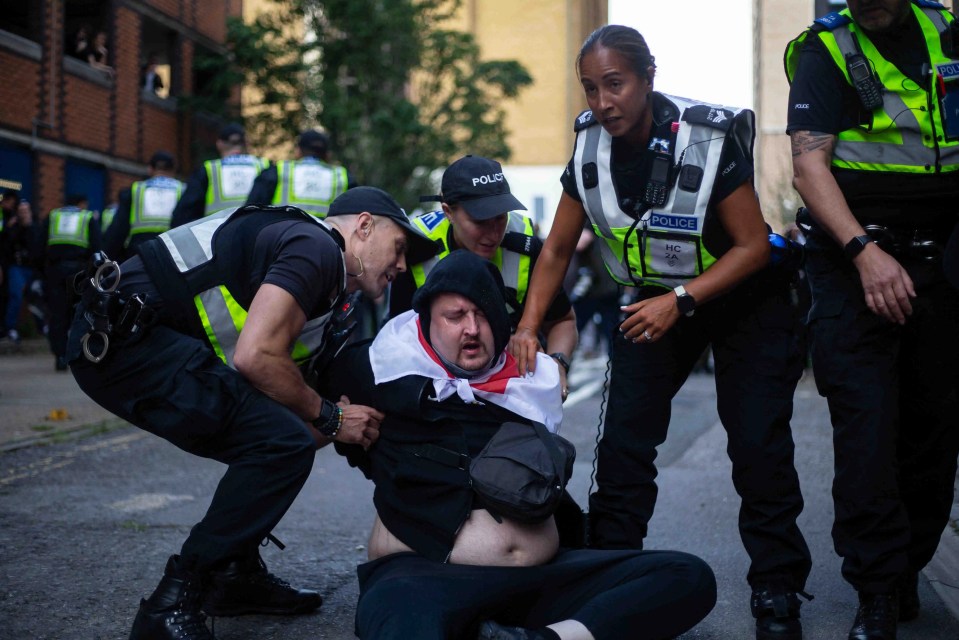 A protester clashes with police during a demonstration in Southampton