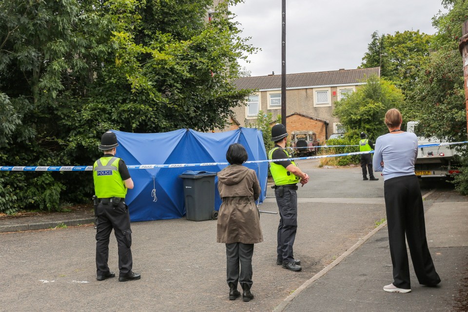 An investigation is underway after a man was found dead outside a house in Birmingham