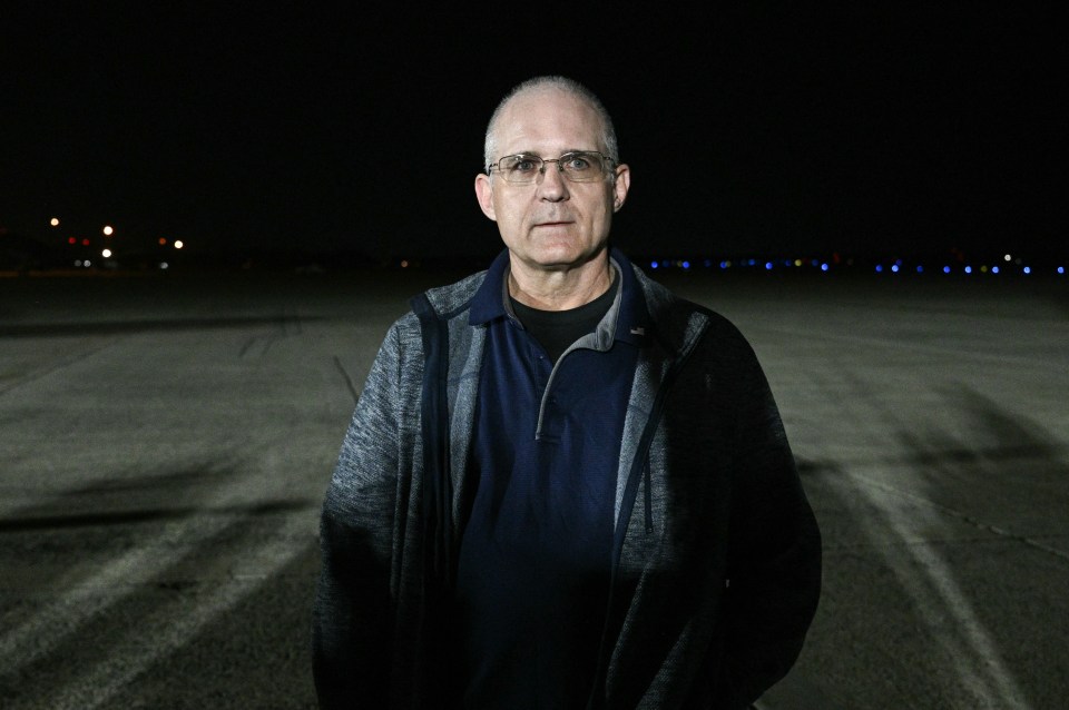 Ex-US Marine Paul Whelan stands on the tarmac as he arrives at Joint Base Andrews in Maryland