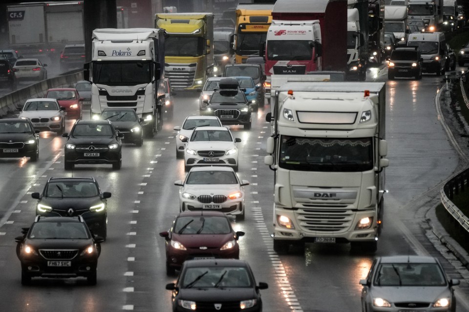 a daf truck is driving down a busy highway