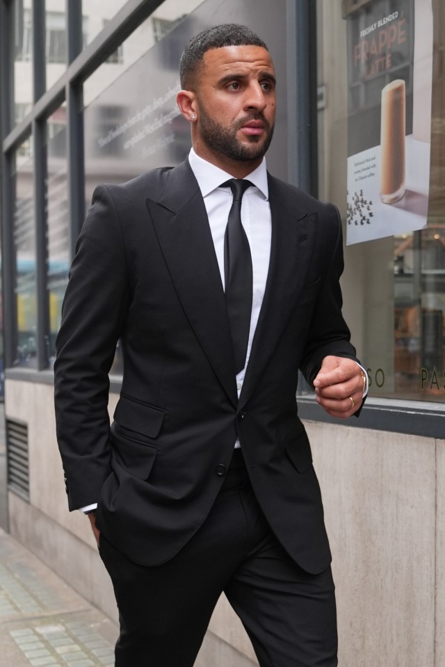 a man in a suit and tie is standing in front of a sign that says espresso blended frappe latte