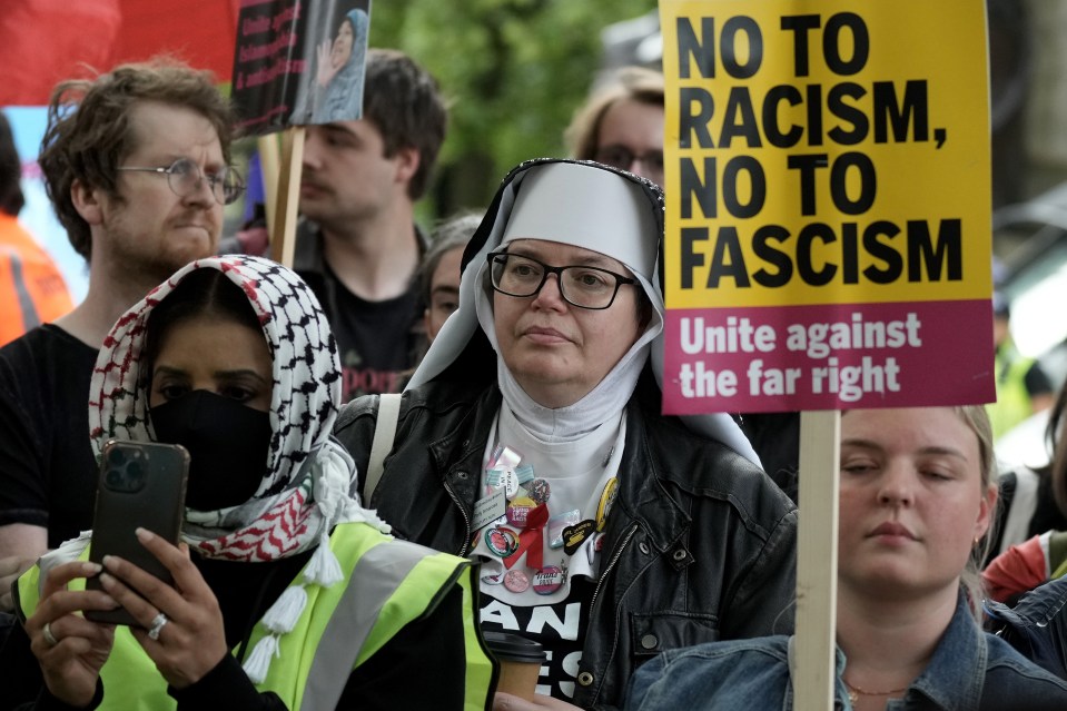 People take part in an anti-racism counter protest