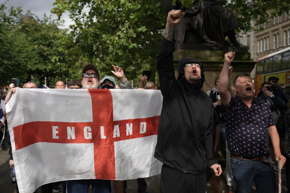 Far-right activists take part in a protest at Piccadilly Gardens, Manchester