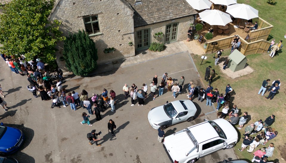 a large group of people are gathered outside of a building