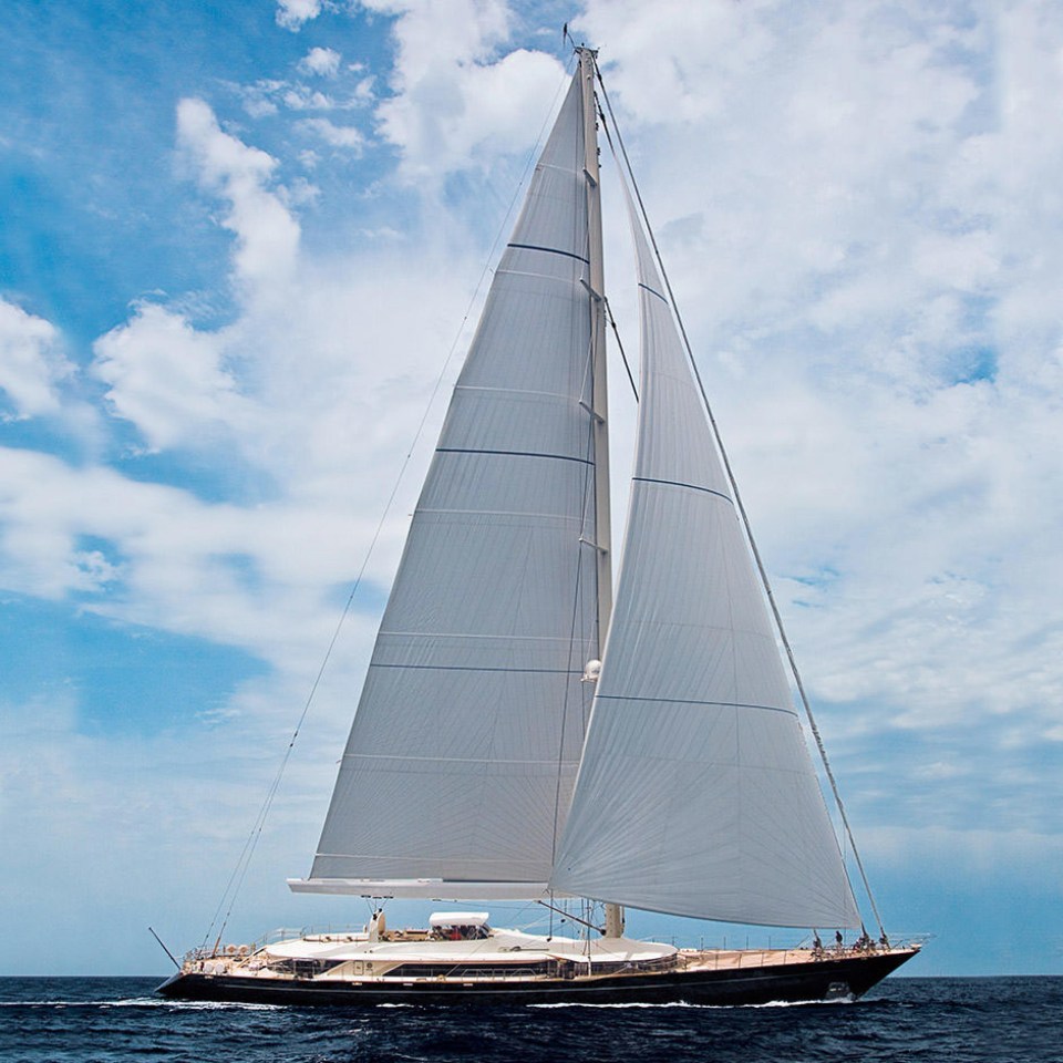 a large sailboat is floating in the ocean