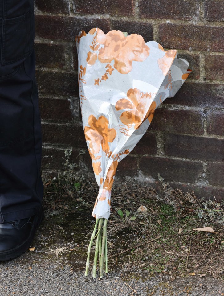 A floral tribute outside the house this morning