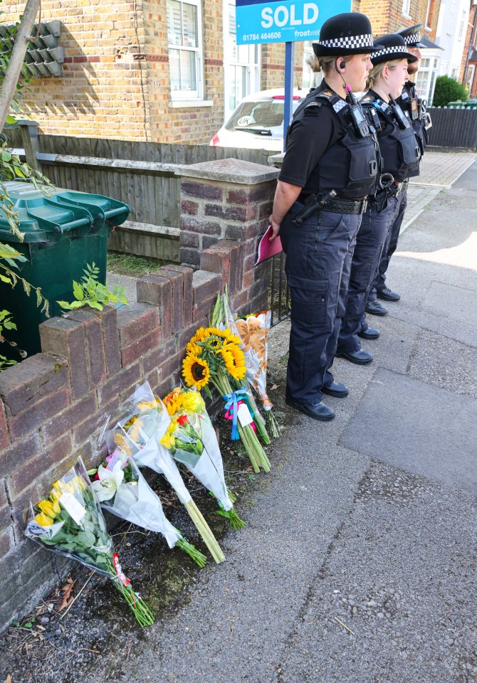 Several floral tributes have been left