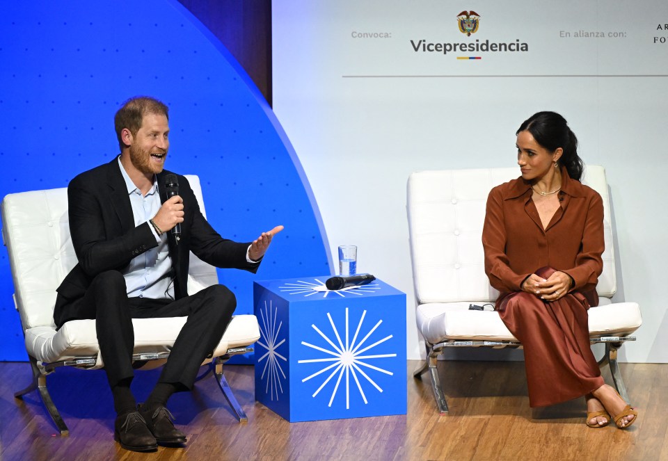 Harry speaks during the 'Responsible Digital Future' forum as his wife Meghan Markle listens in Bogota