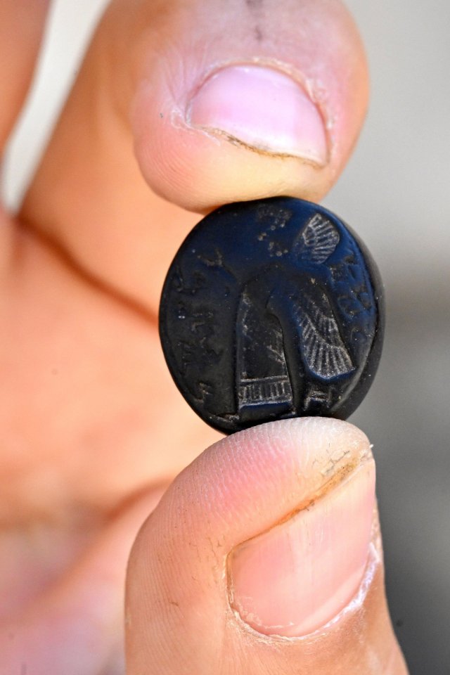 About the size of a dime, the stone seal is approximately 2,700 years old