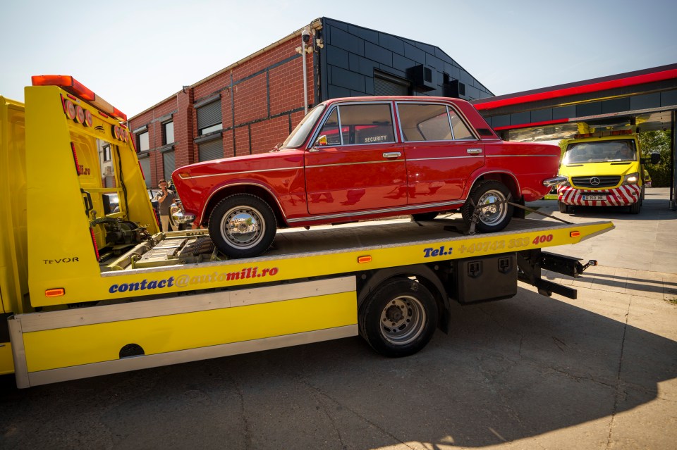 A Russian-made Lada 1500 car is removed by authorities from Andrew Tate’s residence