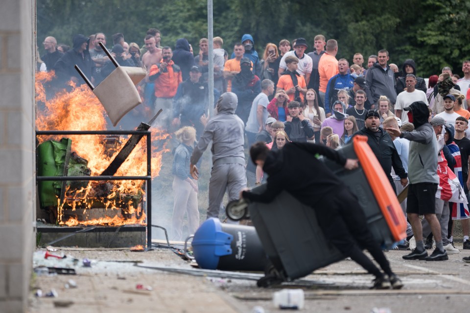 Rioters attempt to enter the Holiday Inn Express Hotel in Rotherham on Sunday