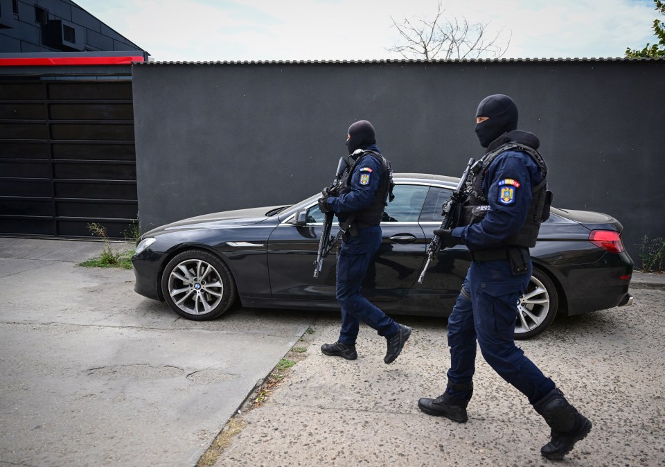 Romanian gendarmes were pictured in front of the residency after the raid