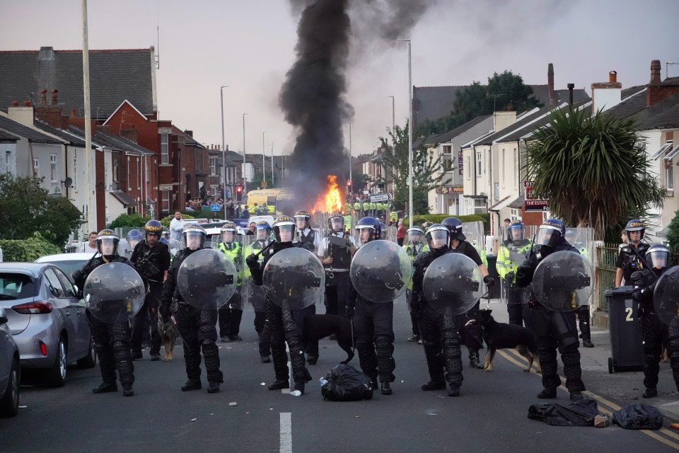 The more extreme the information, the further it will spread, above police hold back protesters near a burning police vehicle in Southport