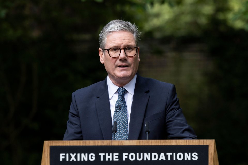 a man stands at a podium that says fixing the foundations