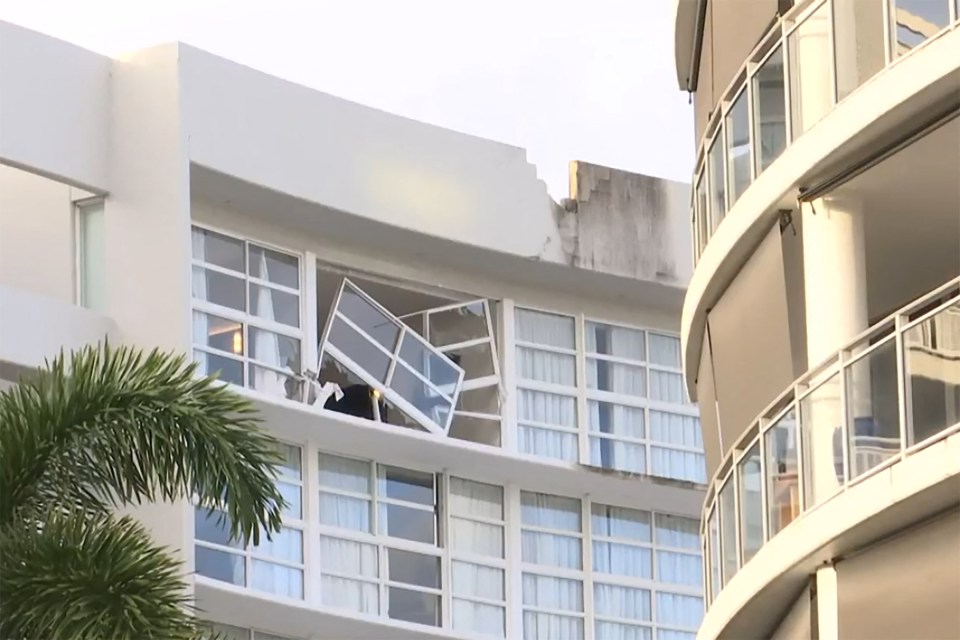 a building with a balcony that has fallen off