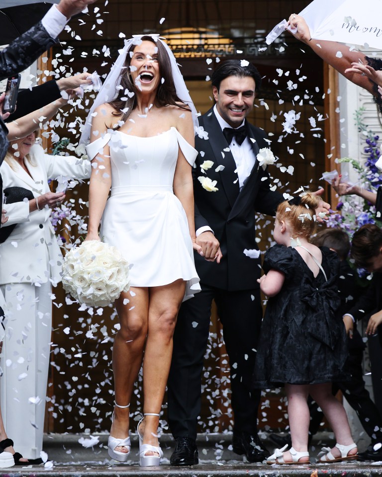 Vicky looked thrilled to finally tie the knot as she emerged from the venue