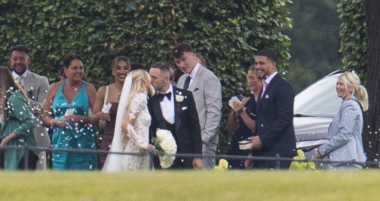 Kelly and Moore shared a kiss as they left the ceremony