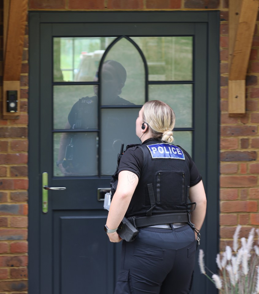 Police were spotted at Katie's new home the day after her arrest at Heathrow Airport earlier this month