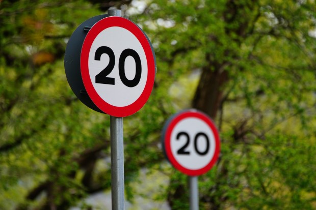 a red and white sign with the number 20 on it