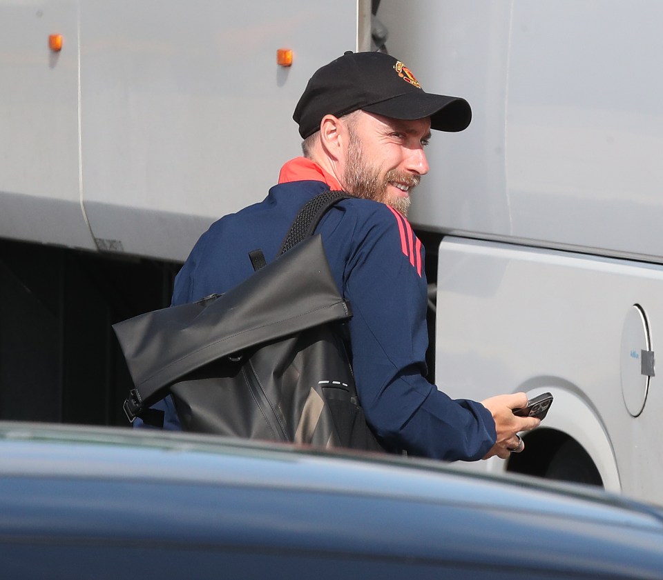 a man wearing a black hat with the word manchester on it