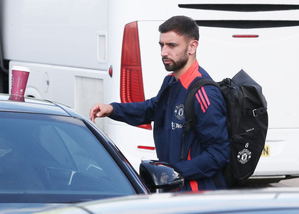 a man with a backpack that says manchester united on it