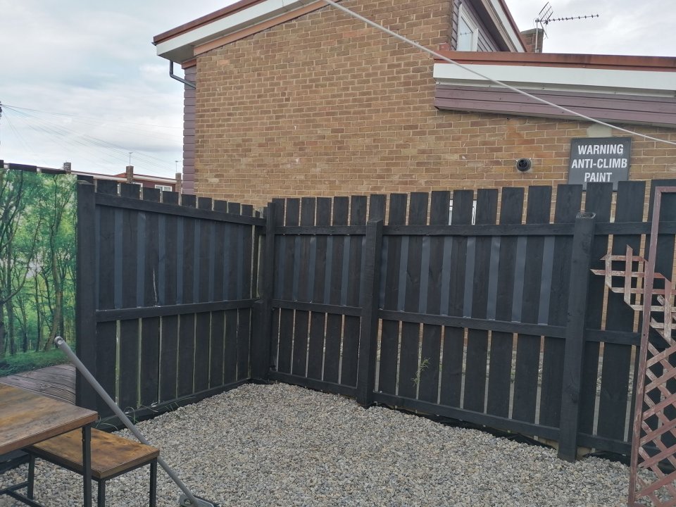 The homeowner stapled the strips of PVC to the fence panels