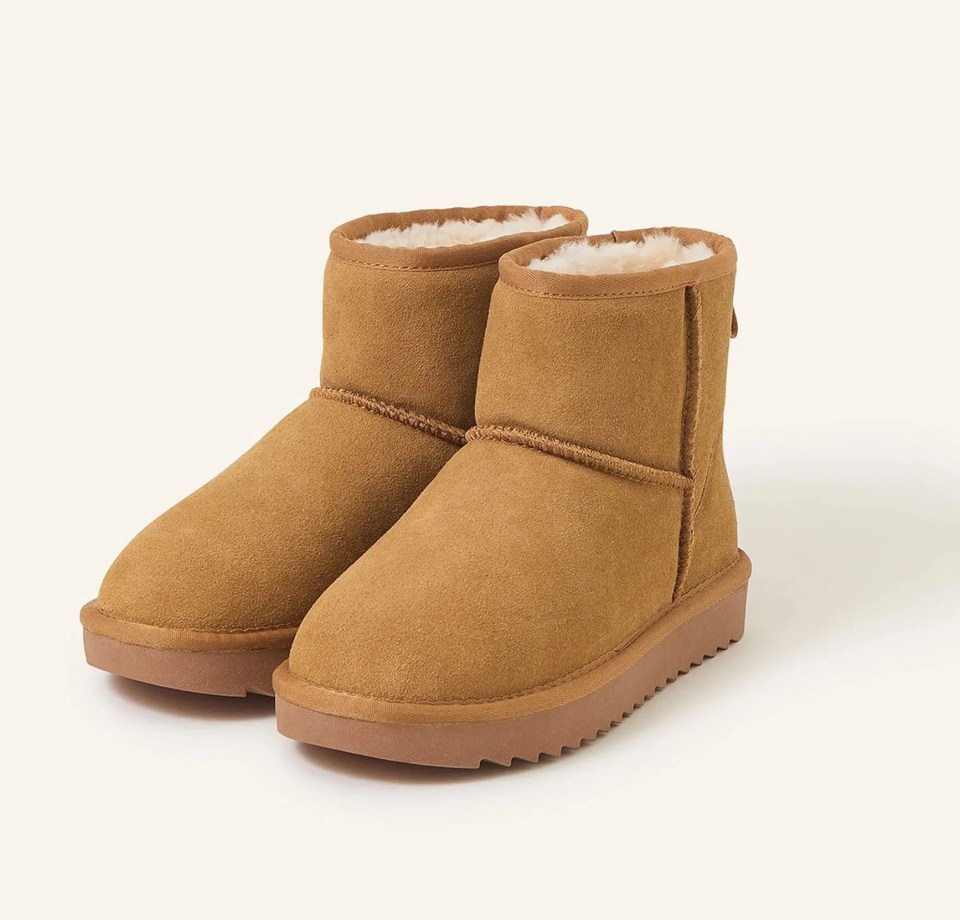 a pair of brown ugg boots on a white background