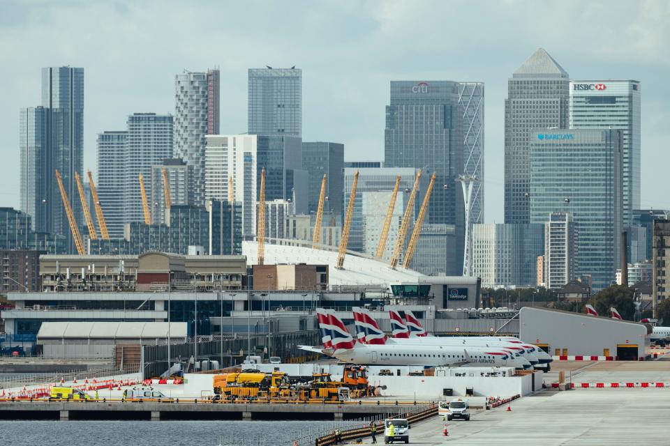 a city skyline with a hsbc building in the foreground