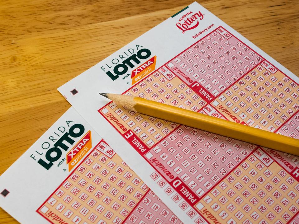 a florida lottery ticket with a pencil on it