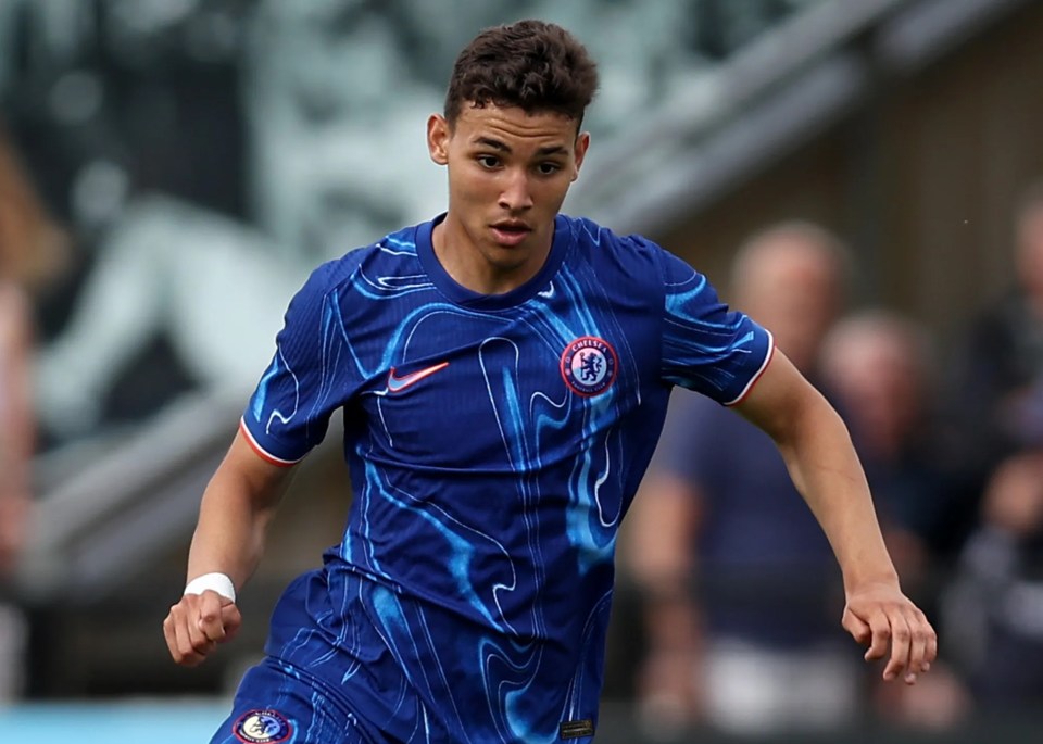 a soccer player wearing a blue shirt with the word chelsea on it